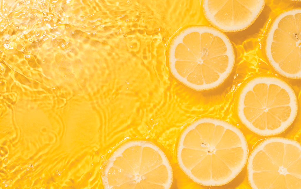 Slices of lemon on a yellow background.