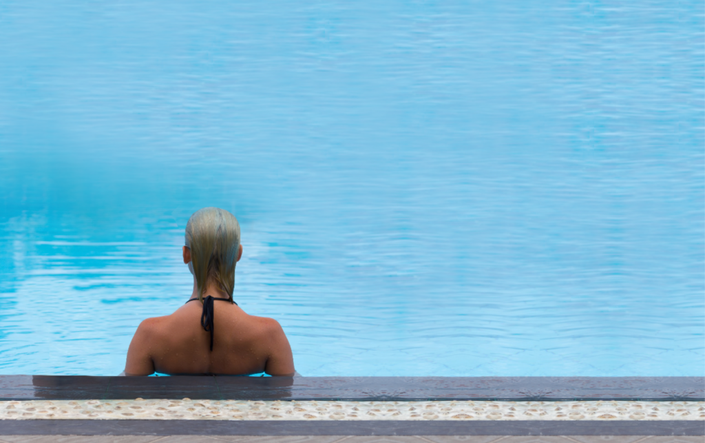 Woman Sits in a Blue Pool