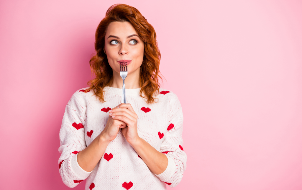 Woman with a Fork and Pink Background