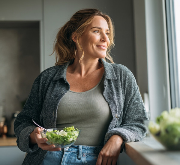 Woman holding a salad